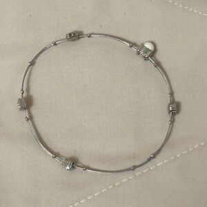 Very cute handmade bracelet w/pearls & rhinestones on sturdy fishing wire.
